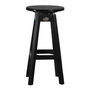 A black swivel bar stool with a round seat, four legs, and a footrest, shown against a plain white background.