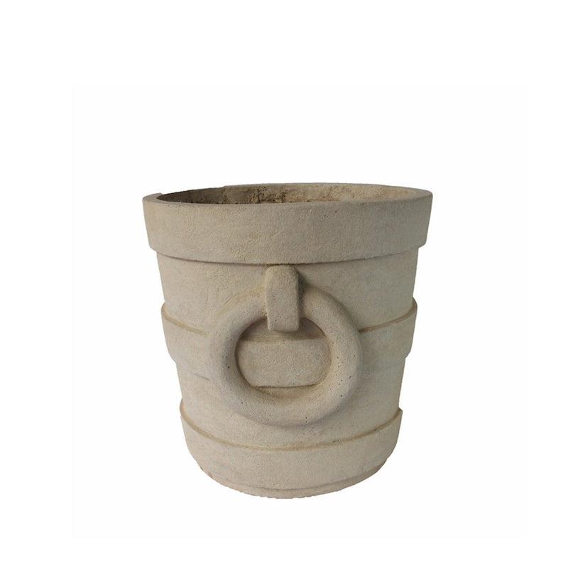 Decorative stone pot with circular design on a white background