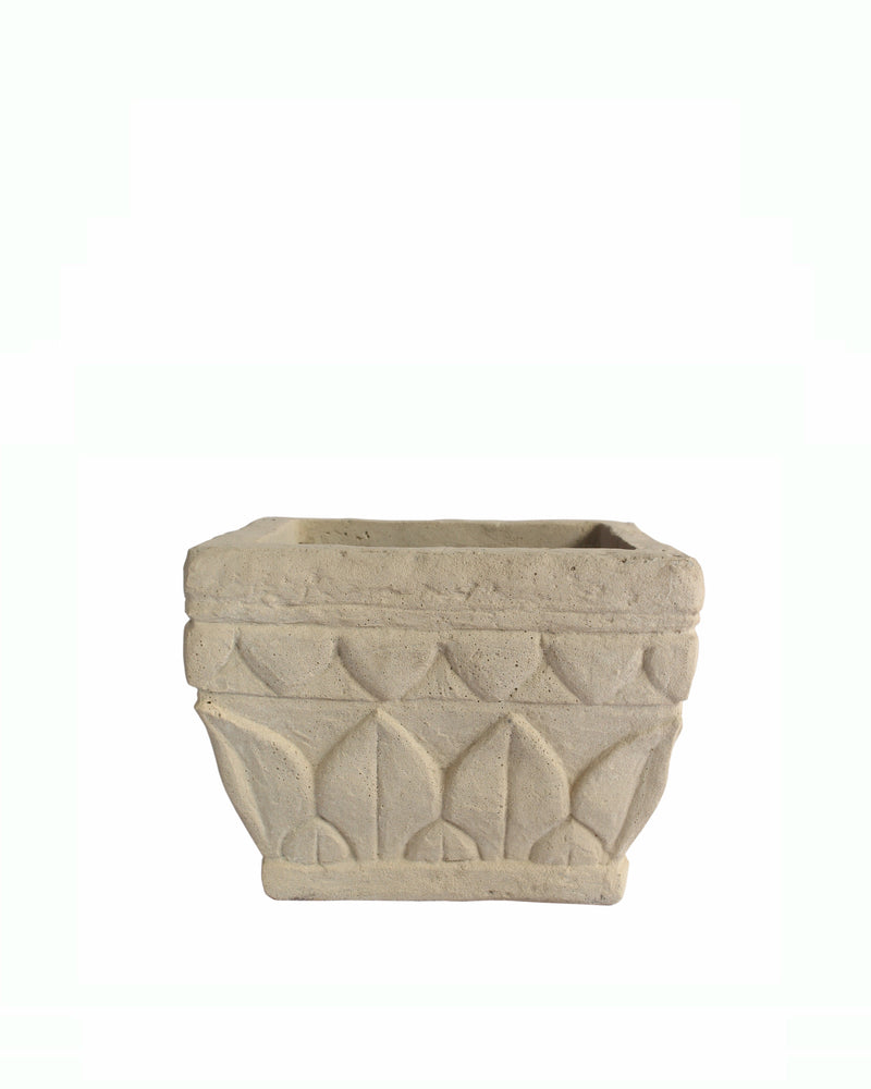 A square, light beige stone planter pot with a textured, embossed geometric pattern on the front, isolated on a white background.