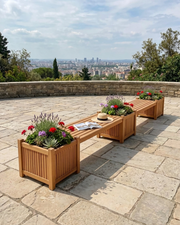 Teak planter bench on a stone patio with view of a city skyline in the distance.  