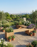 A modern outdoor wooden bench with integrated planter boxes on a stone patio, overlooking a landscaped garden and distant city skyline under a clear blue sky.