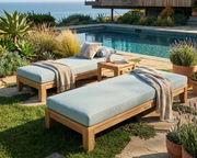 Riviera Daybeds in sizes 60" and 72".  The daybeds are placed on a stone patio near a pool with ocean views.  