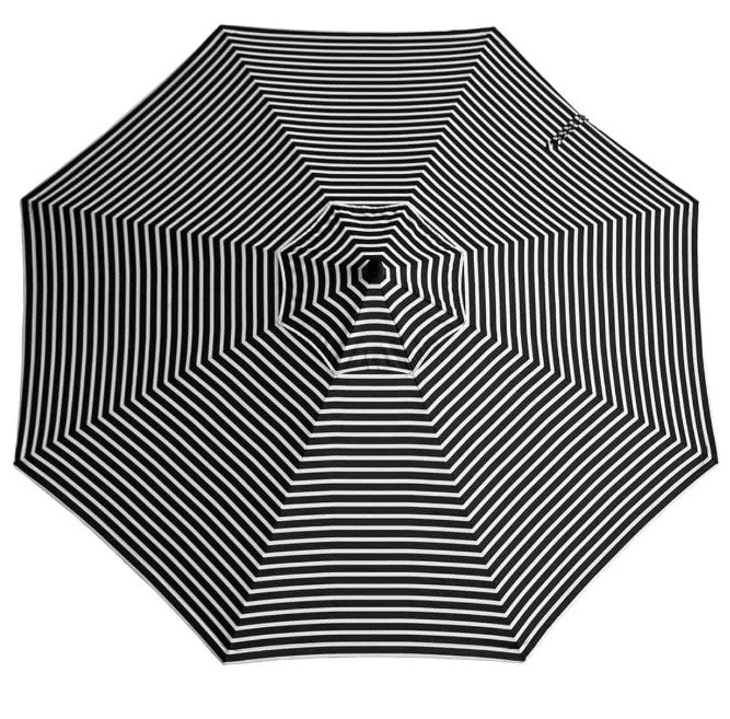 Black and white striped umbrella on a white background