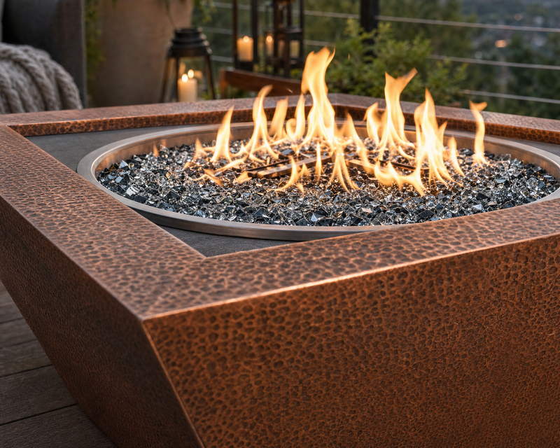 Close up image of the Sedona 40-inch hammered copper fire bowl showing the copper detail and glass media. 