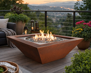 HPC Sedona 40-inch hammered copper fire bowl on a roof top terrace with seating, plants and candles.  The terrace has views of the valley below. 