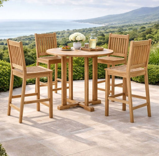 Anderson Teak Bahama Avalon 5-Piece Round Bar Set on a stone patio with ocean views.  