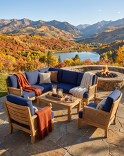 Anderson teak luxe modular set on a stone patio overlooking a mountain and lake view.  