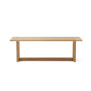Anderson Teak Smyrna dining table - side view on white background. 