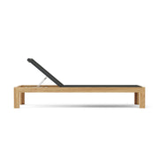 Smyrna teak sun lounger side view with elevated back rest on white background.  