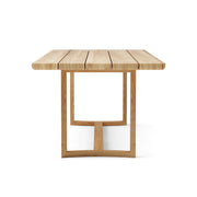 Toscana teak dining table - side view - on a white background.  