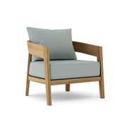 Toscana teak lounge chair with cast mist cushion on white background. 