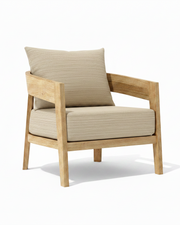 Toscana teak lounge chair with dupione sand cushion on white background. 