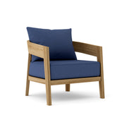 Toscana teak lounge chair with navy cushion on white background. 