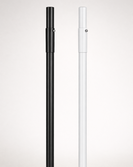 Black and white umbrella poles on a light gray background