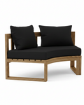Circular teak bench with black cushions on white background.  
