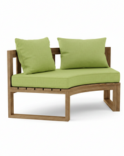 Circular teak bench with macaw cushions on a white background.  