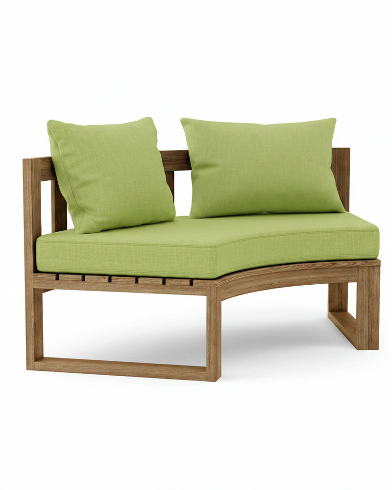 Circular teak bench with macaw cushions on a white background.  