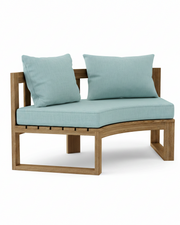 Cicular teak bench with mineral blue cushions on a white background.  