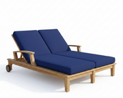 Wooden outdoor lounge chair with blue cushions on a white background