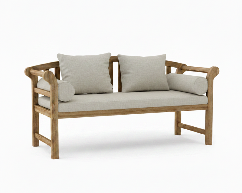 A wooden outdoor bench with a natural oak finish, featuring a light beige seat cushion, two matching back cushions, and two cylindrical bolster pillows, shown on a clean white background.