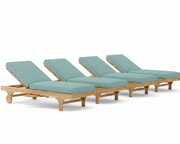 Set of four wooden lounge chairs with teal cushions on a white background