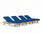 Four wooden lounge chairs with blue cushions on a white background
