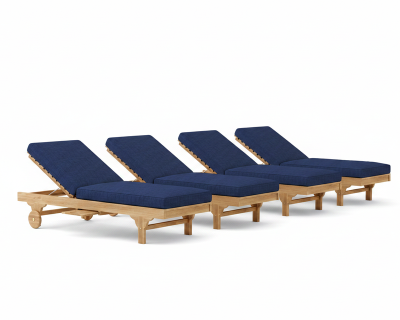 Four wooden lounge chairs with navy cushions on a white background