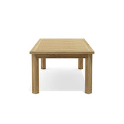 Anderson Teak Chelsea dining table - side view on white background.  