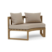 Circular teak bench with cast ash cushions on a white background.  