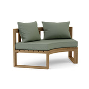 Circular teak bench with cast sage cushions on a white background.  