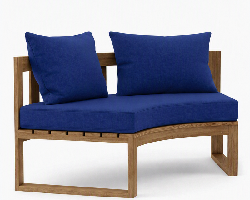 Circular teak bench with true blue cushions on a white background.  