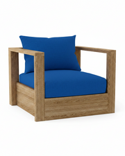 A modern outdoor armchair featuring a natural oak wood frame and vibrant blue cushions, including a backrest pillow and a seat cushion, shown on a solid white background.