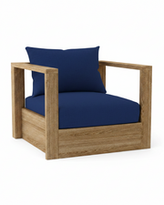 A modern outdoor armchair with a natural oak wood frame and deep navy blue cushions, including a backrest pillow, shown on a solid white background.