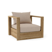 Wooden armchair with beige cushions on a white background