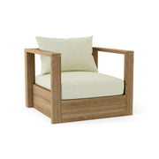 Wooden armchair with white cushions on a white background