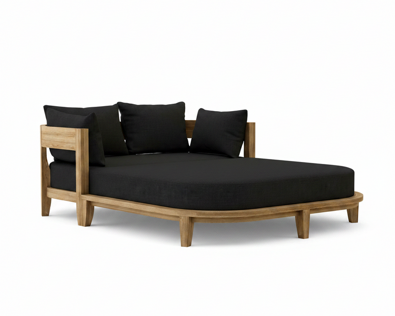 Coronado teak day bed with black cushion on white background.