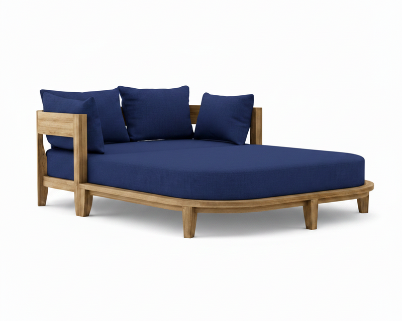 Coronado teak day bed with true blue cushion on white background.
