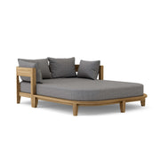 Coronado teak day bed with cast slate cushion on white background.