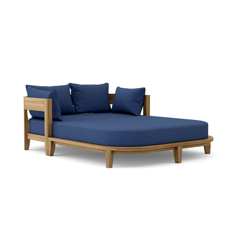 Coronado teak day bed with navy cushion on white background.