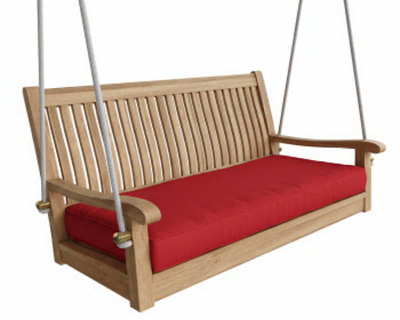 Wooden porch swing with red cushion on a white background