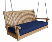 Wooden porch swing with blue cushion on a white background