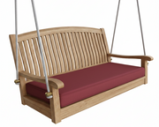 Wooden porch swing with a red cushion on a white background
