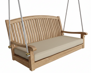 Wooden porch swing with beige cushion on a white background