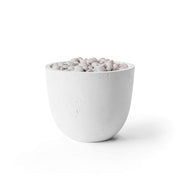 Element natural lightweight concrete firepit with ivory beach stones on a white background.  