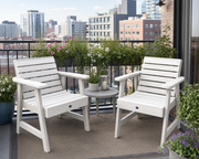 Sequoia garden chairs in white on a city apartment balcony with lush plants.  