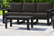 LuxCraft Lanai deep seating sofa with black frame, bare black coffee table and Spectrum Carbon cushions