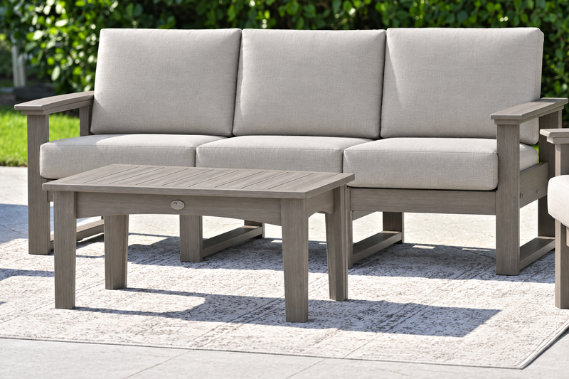 LuxCraft Lanai deep seating sofa with Coastal Gray frame and coffee table, Marine Leatherette Ash Gray cushions
