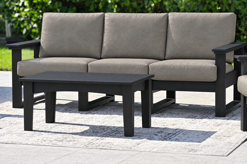 LuxCraft Lanai deep seating sofa with black frame, bare black coffee table and Marine Leatherette Ash Gray cushions