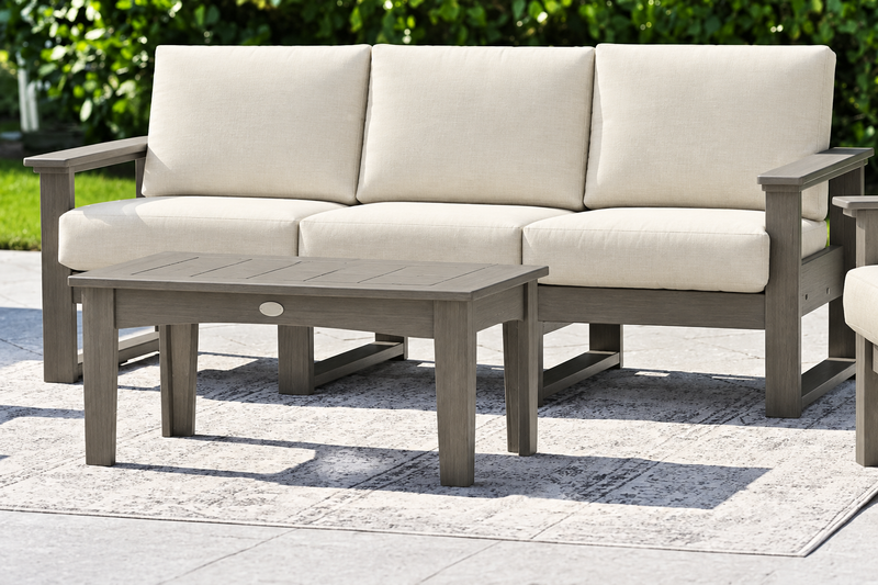 LuxCraft Lanai deep seating sofa with Coastal Gray frame and coffee table, neutral Canvas cushions
