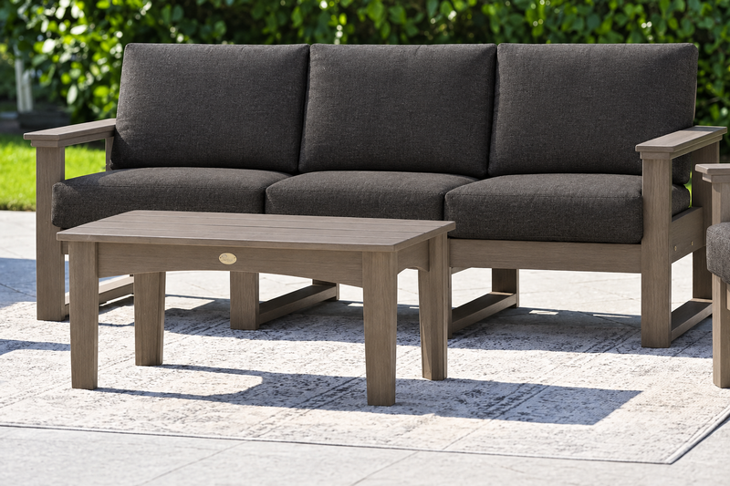 LuxCraft Lanai deep seating sofa with Weatherwood frame and coffee table, Spectrum Carbon cushions